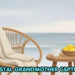 An oversized knit sweater draped over a rattan chair next to a bowl of fresh lemons and a cup of coffee on a porch.